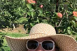 The author standing in front of her favorite apple tree.