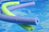 Pool noodles in a swimming pool