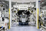 Hyundai car maker’s robotic automotive assembly line with a bunch of robots fixing up the car interiors.