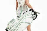 What is the proper way to carry a golf bag?