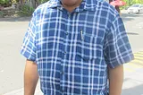 Mike Enriquez standing on roadside at White Plains Quezon City