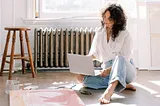 A woman painting and working on her project