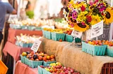 Image of produce at a local farmers market with high prices.