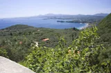 Photo of Corfu showing mountains and a beach