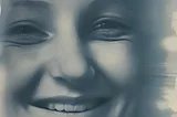 An Ai generated image, made on Vieutopia. It shows an image of woman’s smiling face