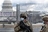 US National Guard troops patrol the vicinity of the US Capitol hours before the Inauguration of US President-Elect Joe Biden.