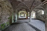 A large room with arches at an old priory