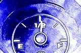 A gas gauge showing half full or half empty, depending on your point of view. Rendered as a blue pen sketch.