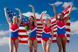 Four American female competitors celebrating