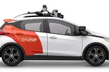 IMAGE: An image of a Cruise autonomous car on a white background