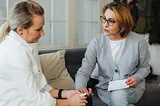 Two older women talking