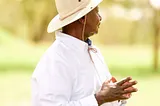 Ugandan President Yoweri Museveni wearing Stetson hat looking into the distance