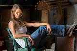 Farm girl in jeans and white t shirt