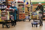 Seniors shop for groceries at Northgate Gonzalez Market in Los Angeles during special hours open to seniors and the disabled.