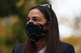 Alexandria Ocasio-Cortez wearing a face mask.