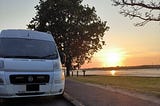 The author’s campervan by the side of the road at dusk.