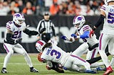 Damar Hamlin of the Buffalo Bills tackling Tee Higgins of the Cincinnati Bengals on Monday Night Football on January 1, 2023