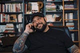 Christian Picciolini talks on the phone.