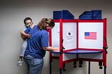 A woman casts her ballot for the 2020 presidential election at an early voting center on Oct. 1, 2020 in Alexandria, Virginia