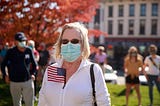 A woman seen with an American flag gathering at a Protect the Results rally at the Monroe County courthouse in Indiana