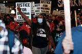 Black woman protesting the grand jury decision in Breonna Taylor’s case.