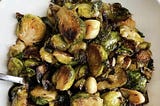 A plate of roasted Brussels sprouts with garlic