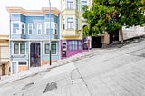 Historic colorful buildings along one of San Francisco’s steepest streets near the Telegraph Hill residential area.