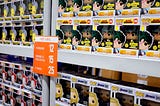 Boxes of Funko Pop figurines on shelves.