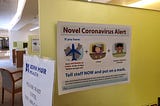 Warning sign with text reading “Novel Coronavirus Alert”, referring to quarantine and screening procedures.