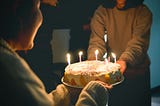 Birthday cake with candles for a woman.