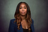 Headshot of Annie Jean-Baptiste in a blue blazer