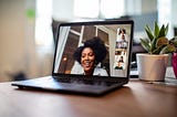 Businesswoman having a video call meeting with her team.