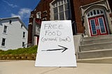 A “free food” sign in front of a church.