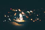 A person’s hand with stringed lights
