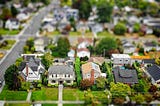 A diorama of a neighborhood with model homes