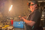 Dan Macchiarini fires up a blow torch in his North Beach metalworks shop Macchiarini Creative Design. He is a longtime proponent of a commercial vacancy tax.