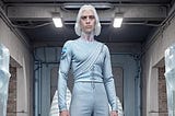 A tall alien male, 37 years old, ((shoulder-length white hair)), oval face, ((ice-blue sclera:1.5)), pale skin, in a long-sleeved gray tunic, blue trousers, black boots, stern visage, with his arms crossed, in a an abandoned basement