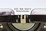 2021 New Year’s Resolutions typed by a typewriter.