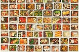 A set of a variety of healthy foods in take away food boxes against a white background.