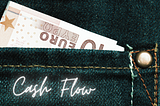 A European currency slipped in the back jeans’ pocket, with the text overlay that says “Cash Flow”