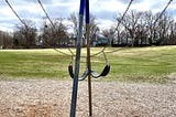 Two swings tangled together.