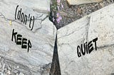 Photo of rocks with text “(Don’t) keep quiet