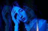 A Moody Blue Double Exposure Photograph of Woman at Night