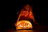 Woman lighting candles for Diwali.