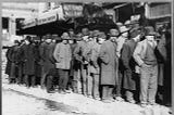 unemployed men on a bread line