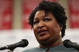 A closeup photo of Stacey Abrams speaking at an event.