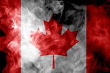 Canadian flag surrounded by white smoke