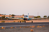 A single-engine airplane taxiing.