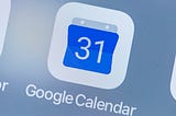 A smart phone with the icons for the Google Calendar app