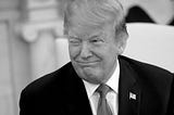 Black-and-white photo of Donald Trump looking off to the right and winking.